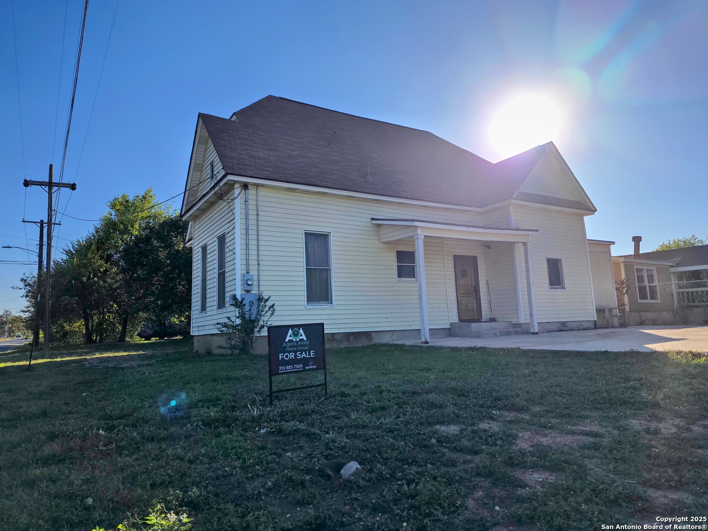 a backyard of a house with table and chairs