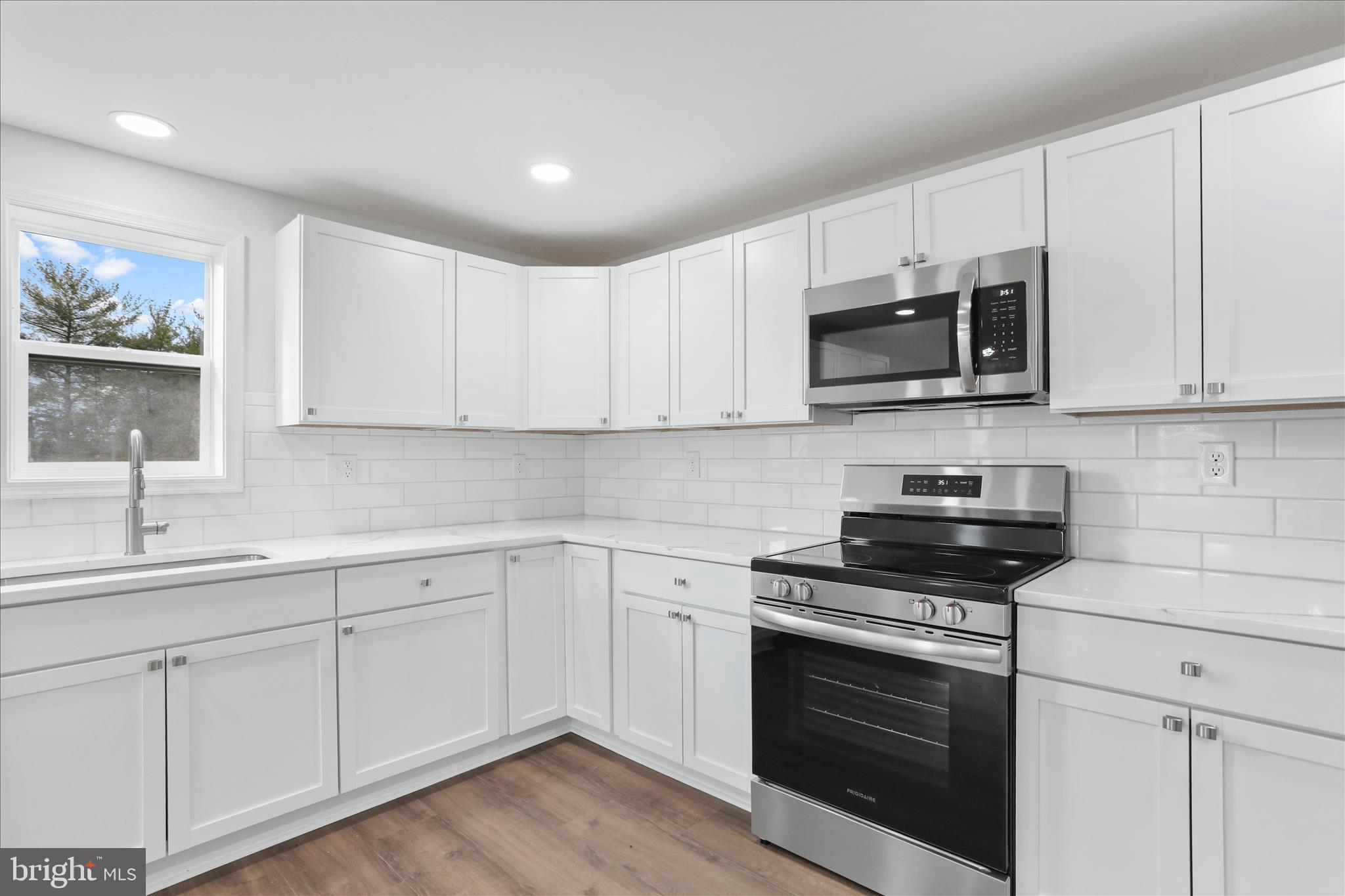 485 Bedington Road Martinsburg, WV 25404 - Photo 12 of 37 a kitchen with white cabinets and appliances