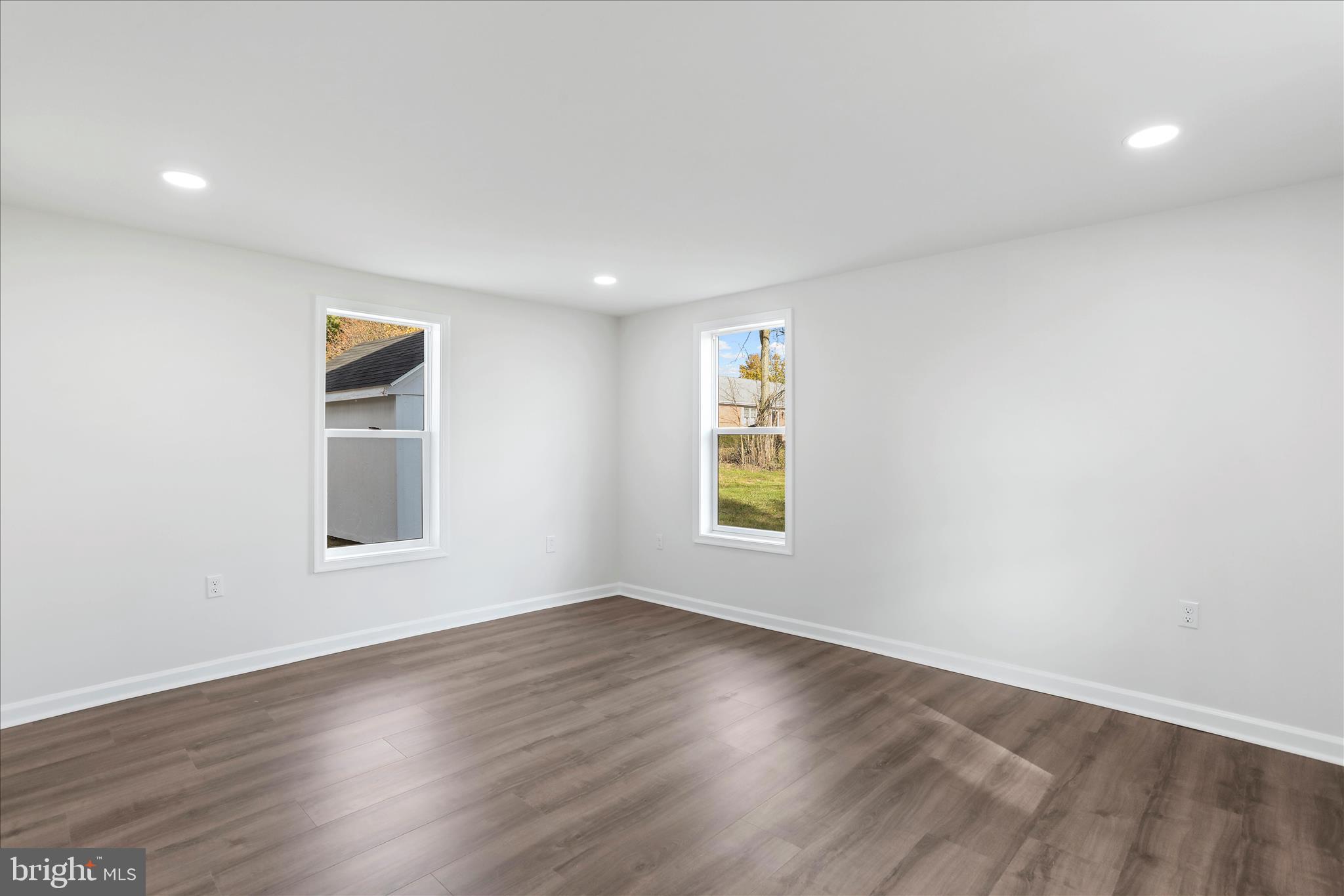 485 Bedington Road Martinsburg, WV 25404 - Photo 17 of 37 an empty room with wooden floor and windows