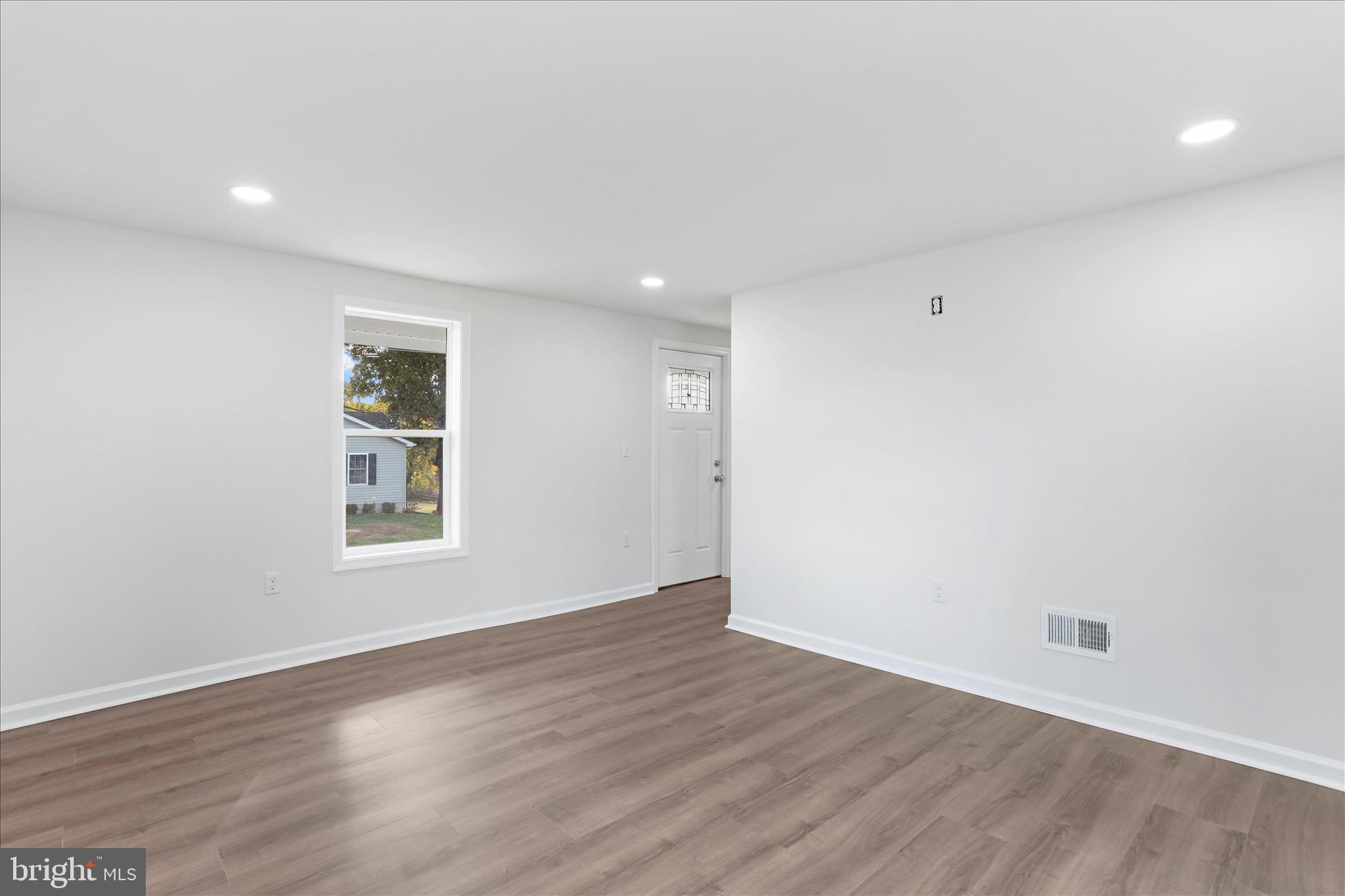 485 Bedington Road Martinsburg, WV 25404 - Photo 18 of 37 an empty room with wooden floor and windows