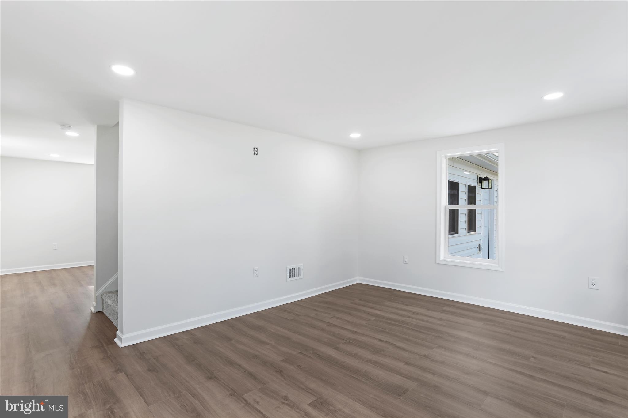 485 Bedington Road Martinsburg, WV 25404 - Photo 19 of 37 a view of an empty room with wooden floor and a window