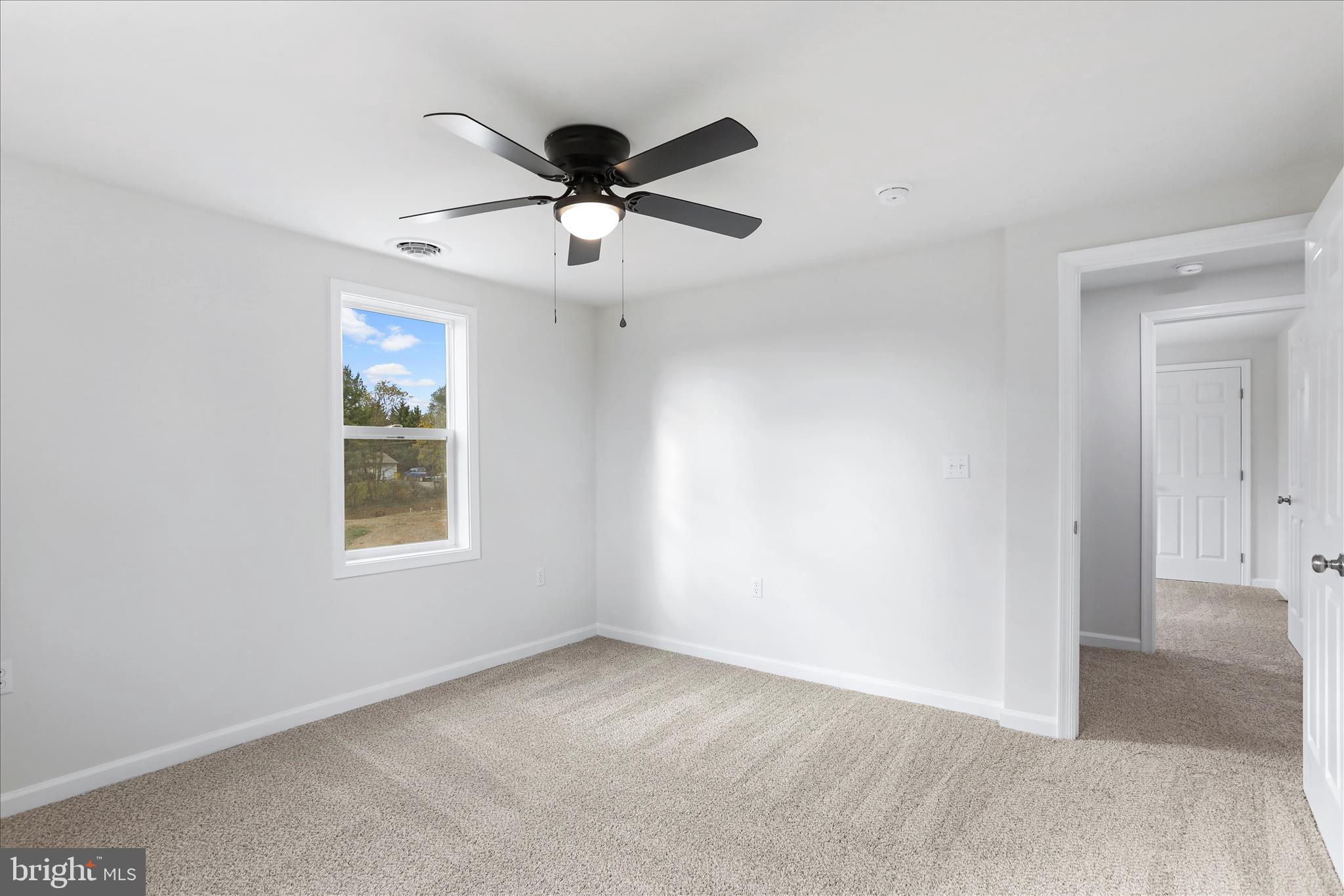 485 Bedington Road Martinsburg, WV 25404 - Photo 28 of 37 an empty room with a window and a fan
