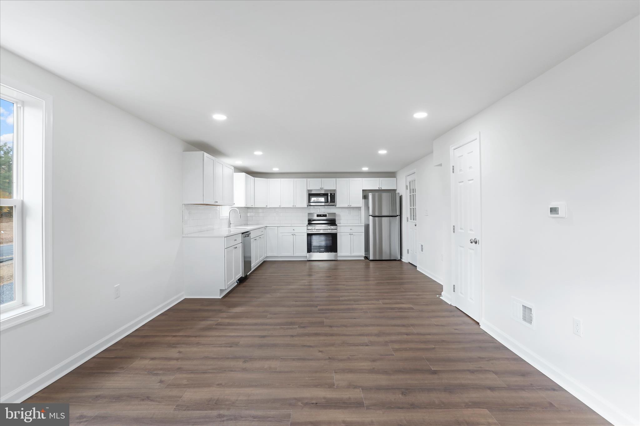 485 Bedington Road Martinsburg, WV 25404 - Photo 4 of 37 a view of kitchen with wooden floor and window