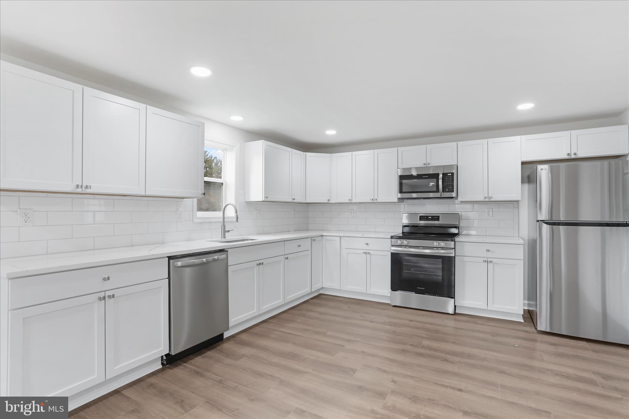 485 Bedington Road Martinsburg, WV 25404 - Photo 8 of 37 a kitchen with granite countertop white cabinets and stainless steel appliances