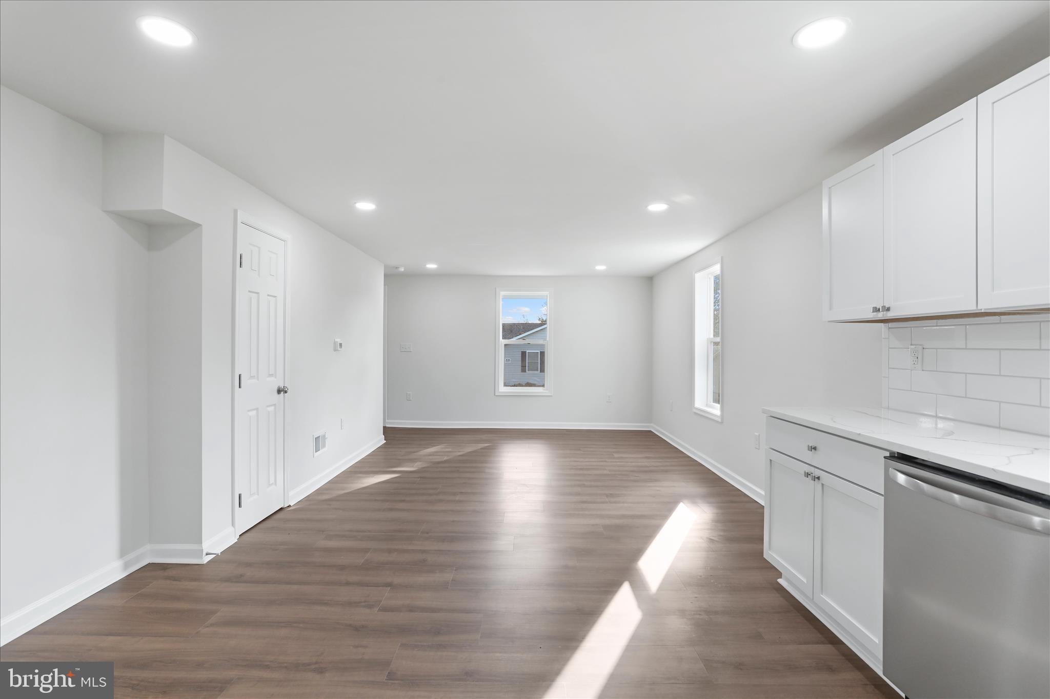 485 Bedington Road Martinsburg, WV 25404 - Photo 10 of 37 an empty room with wooden floor and windows