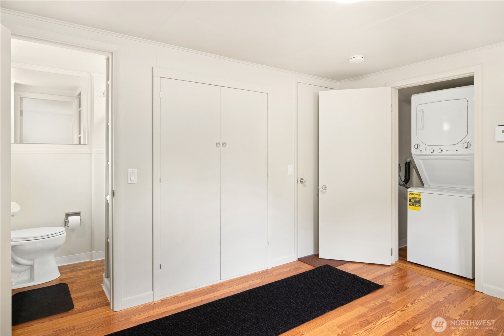 301 E Street Port Townsend, WA 98368 - Photo 13 of 19 a view of bathroom with a toilet a mirror and a shower