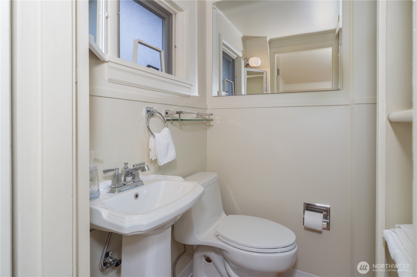 301 E Street Port Townsend, WA 98368 - Photo 14 of 19 a bathroom with a toilet sink and mirror
