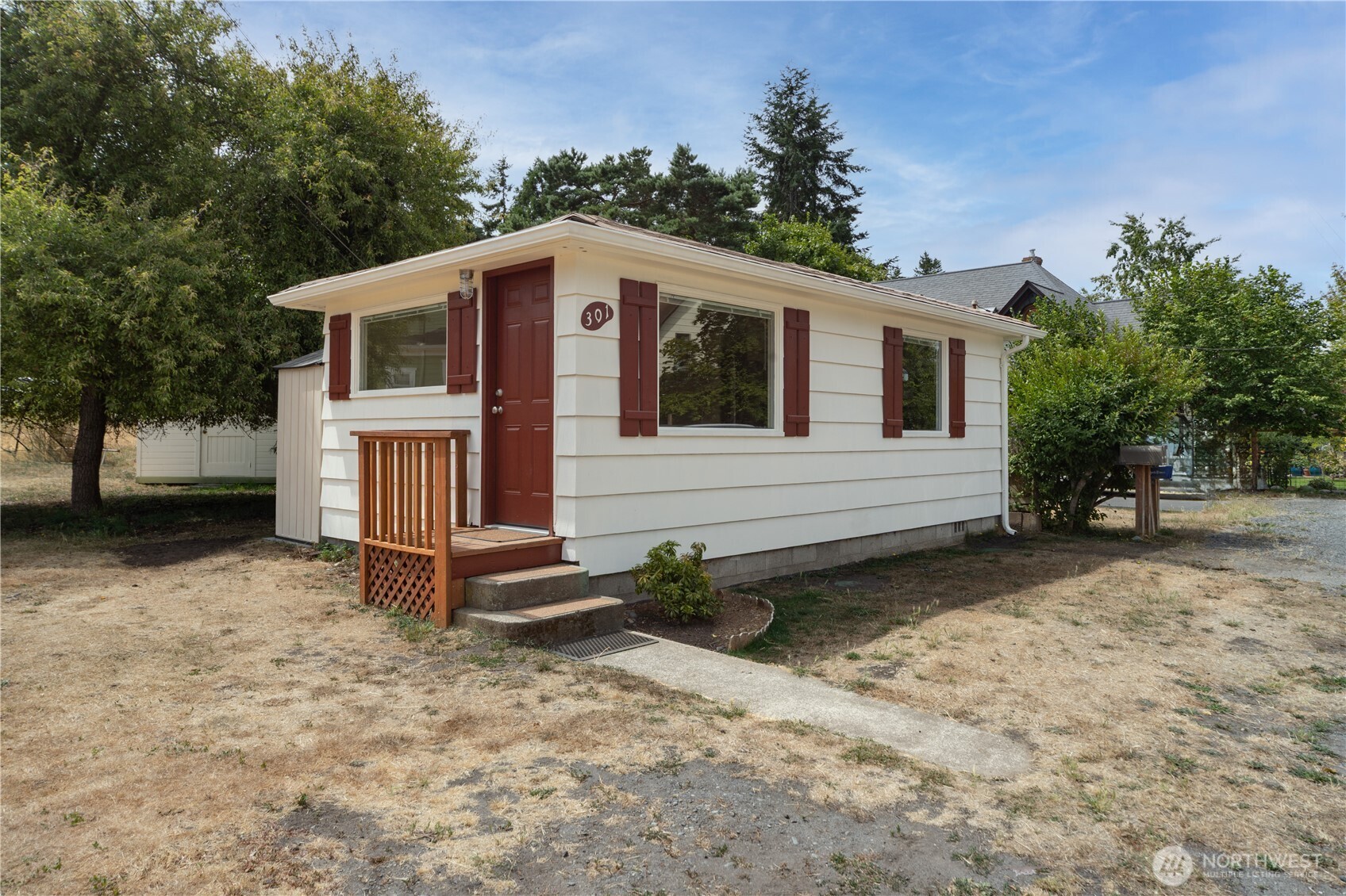 301 E Street Port Townsend, WA 98368 - Photo 16 of 19 a view of a house with a yard