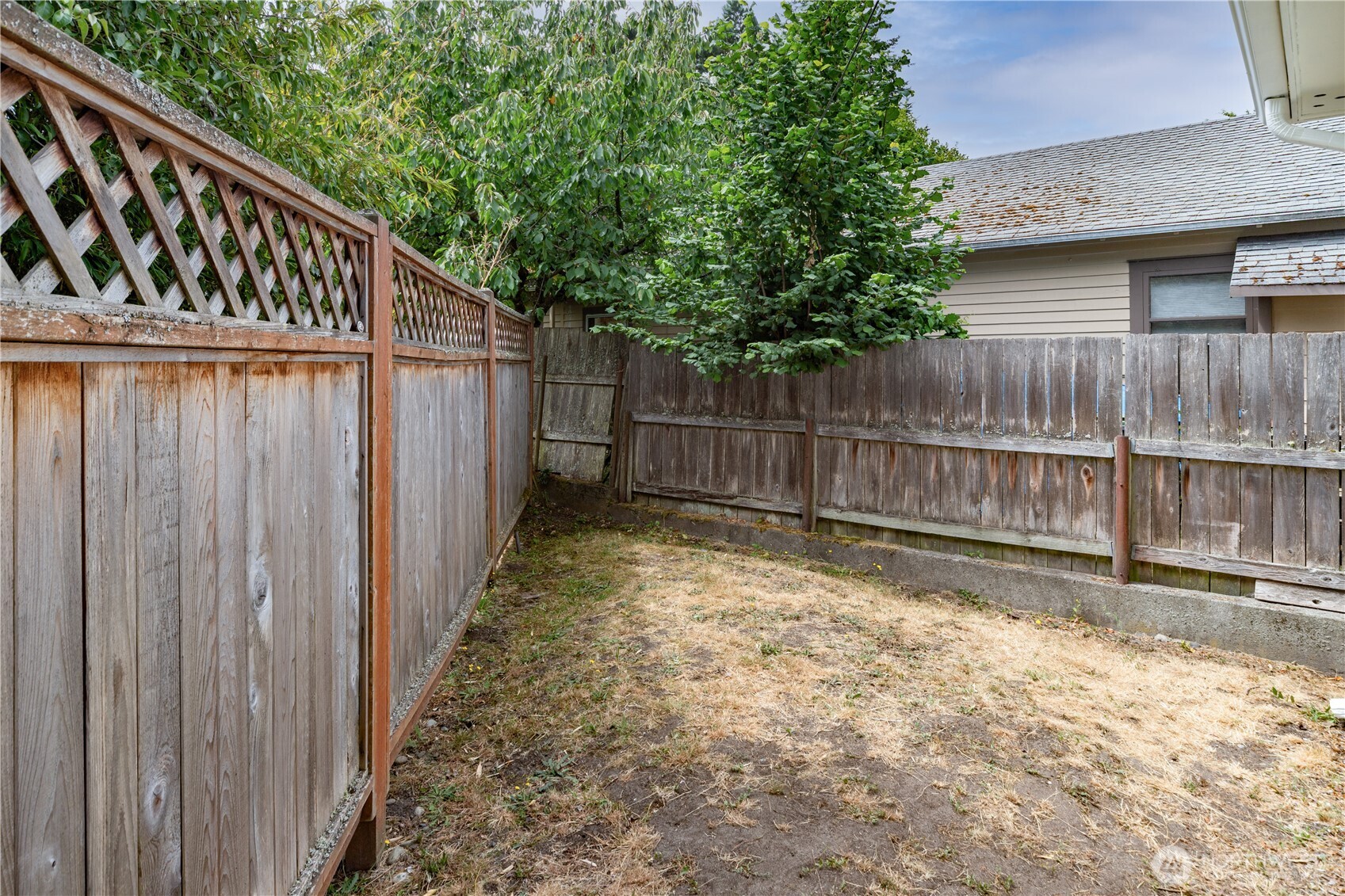 301 E Street Port Townsend, WA 98368 - Photo 19 of 19 a view of wooden fence with a small yard