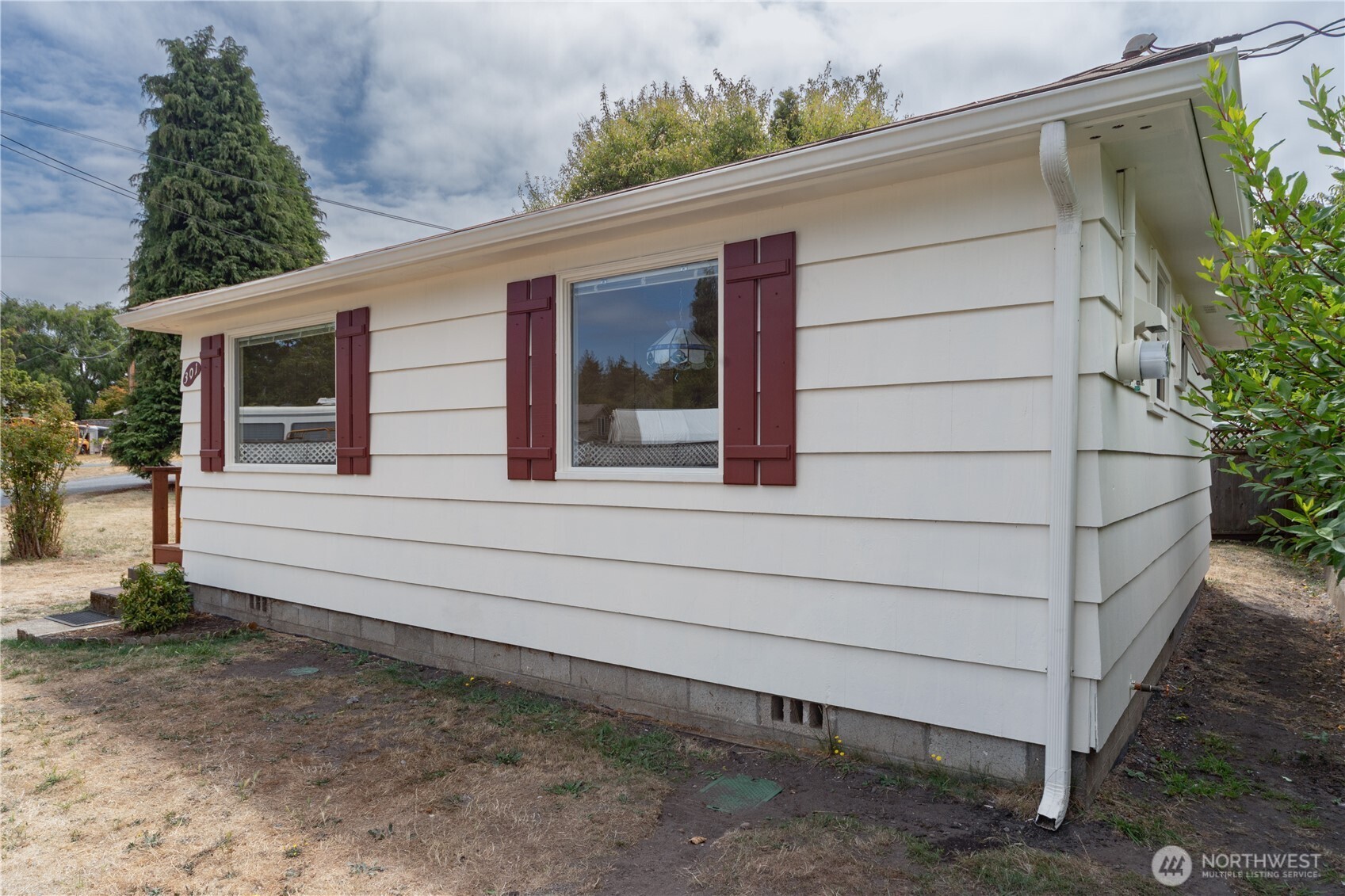301 E Street Port Townsend, WA 98368 - Photo 3 of 19 a small white building with a large window and yard