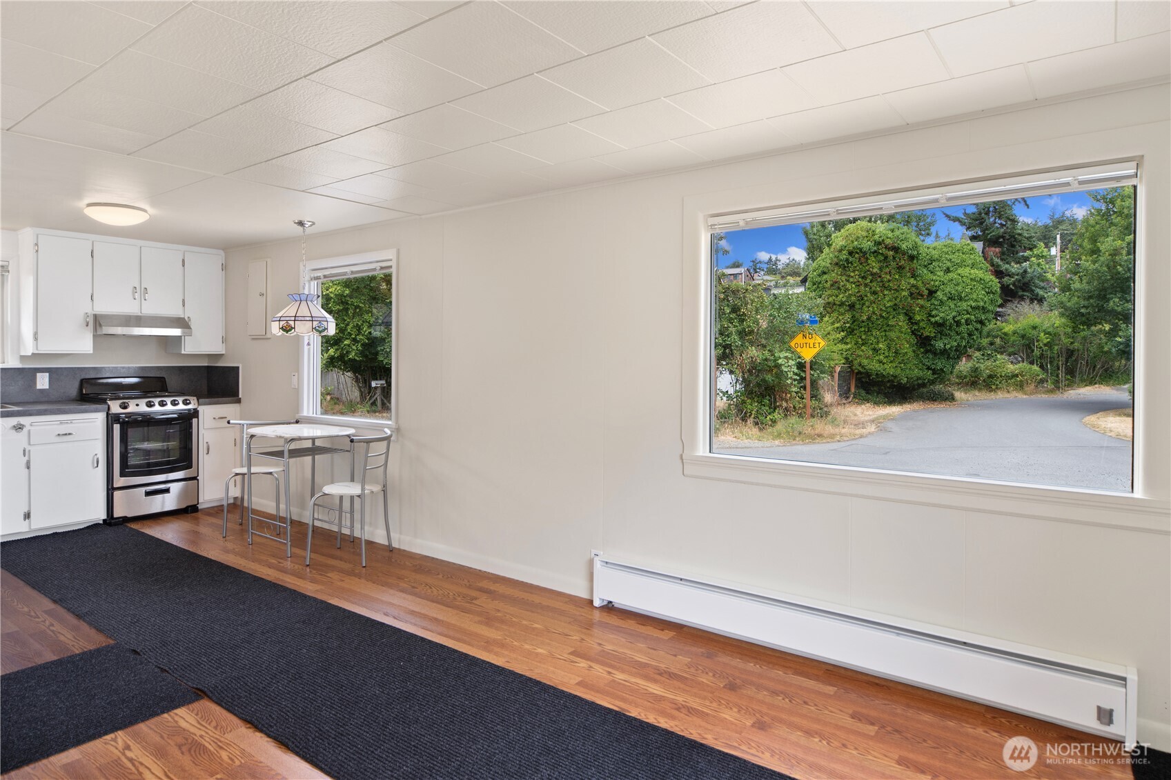 301 E Street Port Townsend, WA 98368 - Photo 5 of 19 a kitchen with stainless steel appliances a stove top oven and a refrigerator