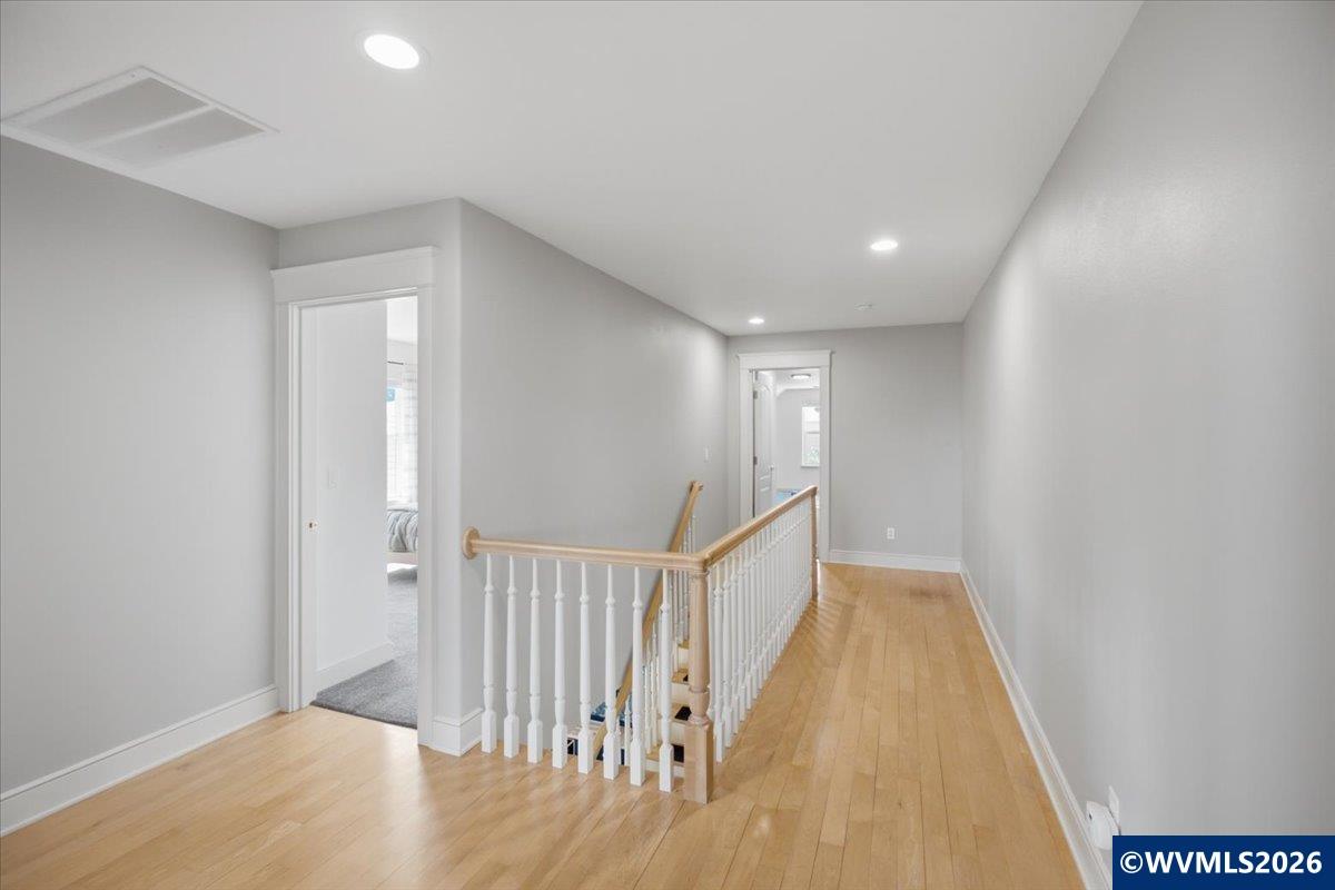 1492 Northwest Penny Lane Albany, OR 97321 - Photo 40 of 50 a view of a hallway with wooden floor