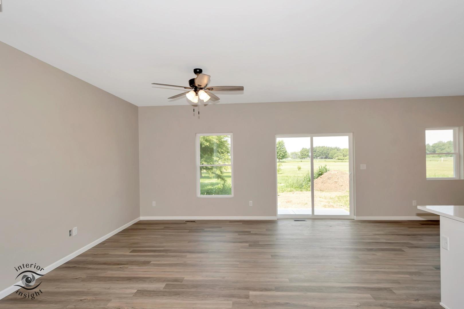 1317 Sioux Turn Kankakee, IL 60901 - Photo 13 of 35 wooden floor in an empty room with a window