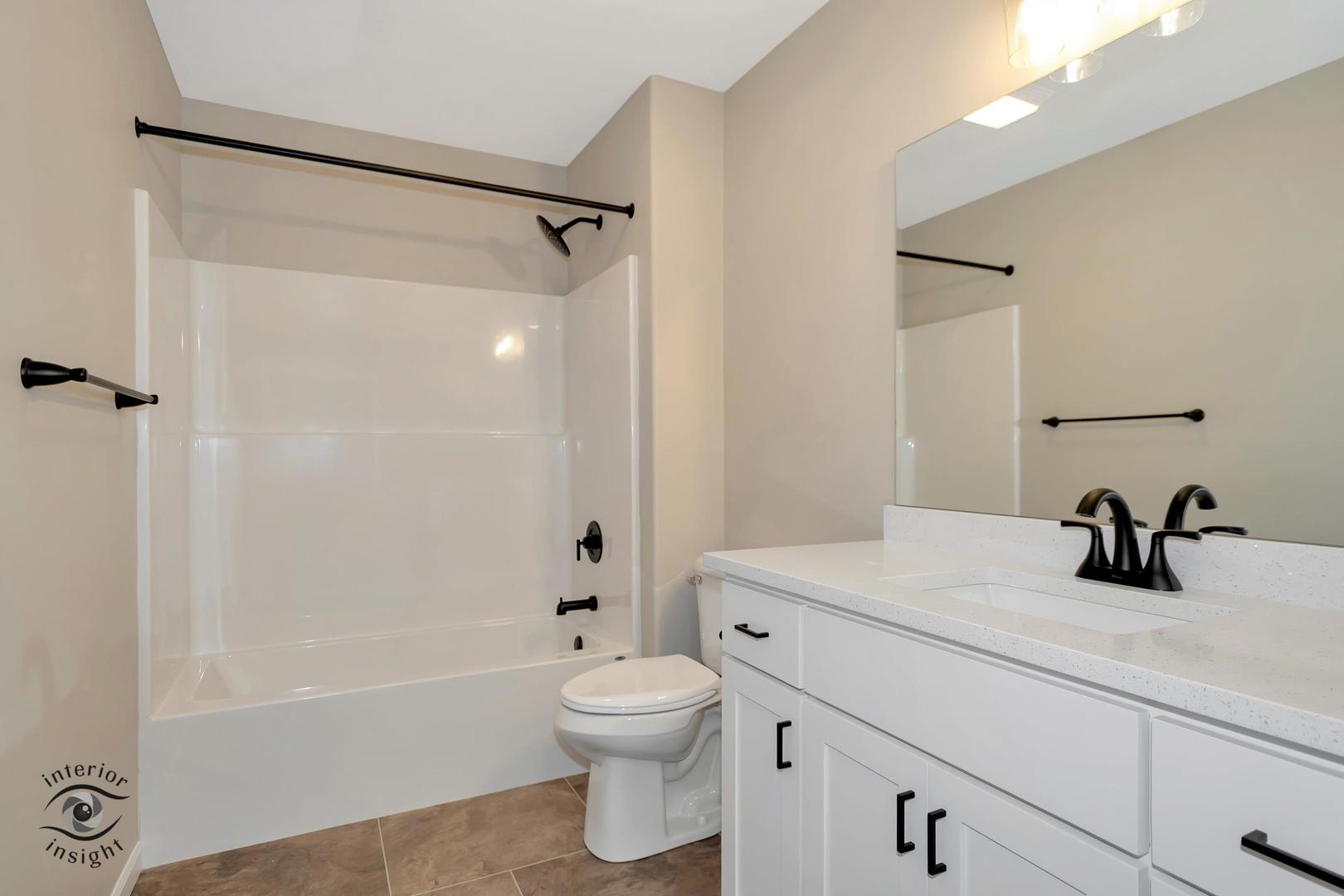 1317 Sioux Turn Kankakee, IL 60901 - Photo 23 of 35 a bathroom with a sink a toilet and shower
