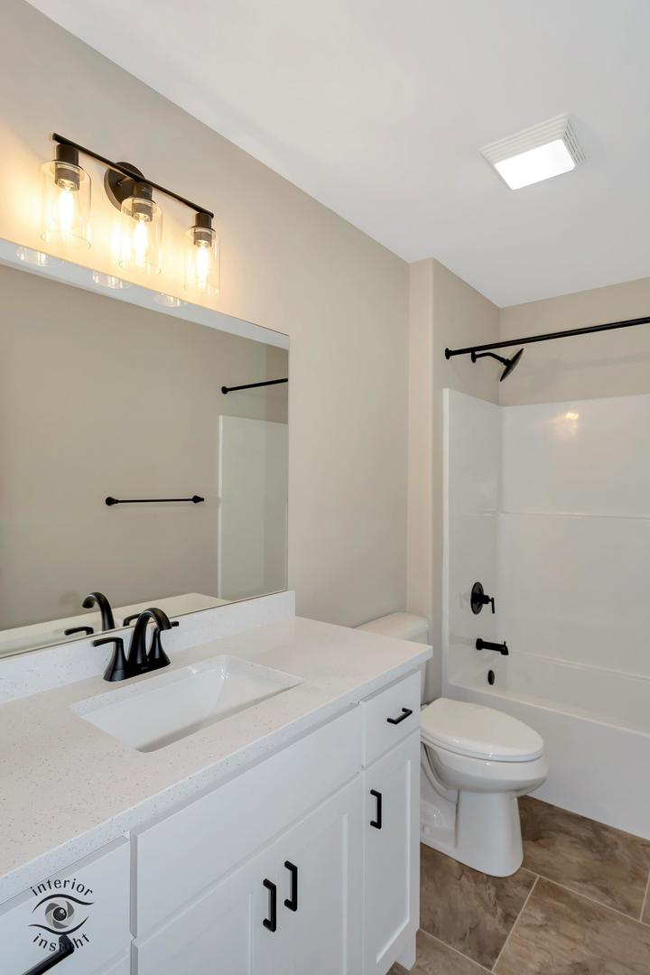 1317 Sioux Turn Kankakee, IL 60901 - Photo 25 of 35 a bathroom with a sink a toilet and a mirror