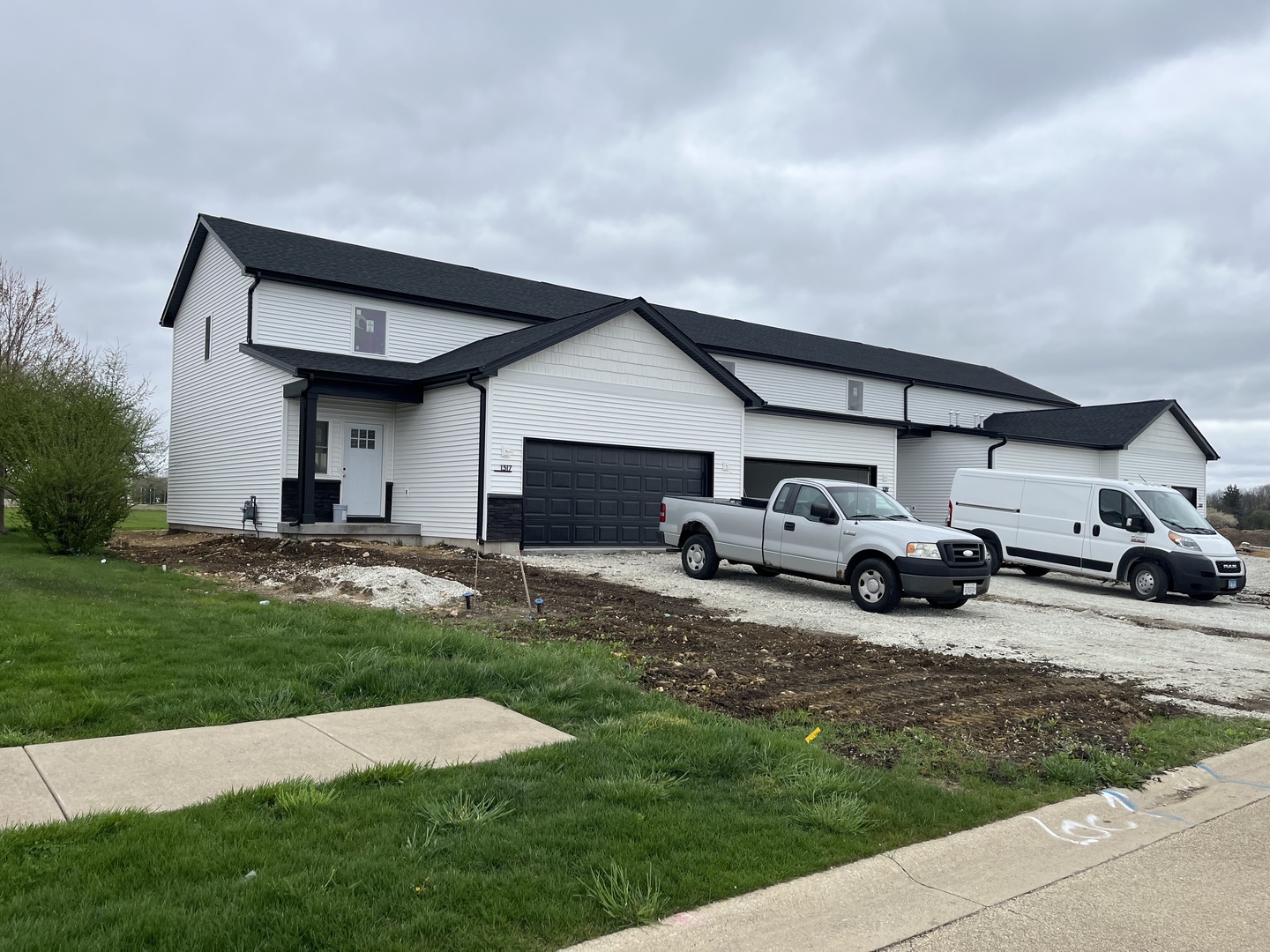1317 Sioux Turn Kankakee, IL 60901 - Photo 3 of 35 a front view of a house with a garden and parking space