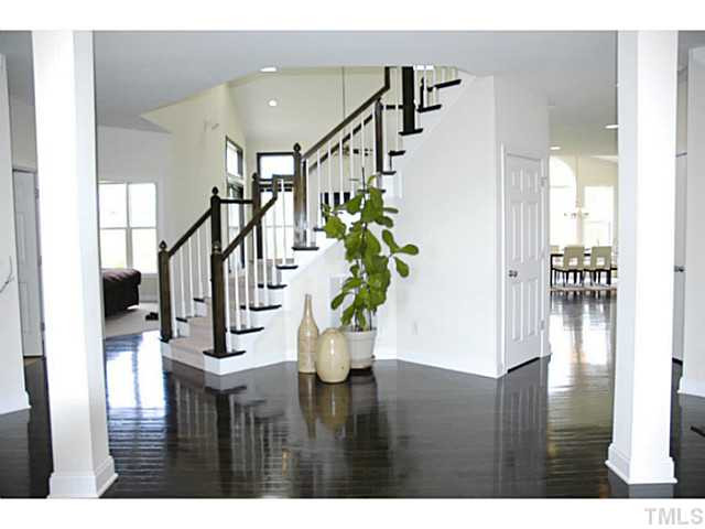 702 Ivyshaw Road Cary, NC 27519 - Photo 2 of 25 Grand foyer with columns and gleaming hardwoods welcomes you home! Foyer
