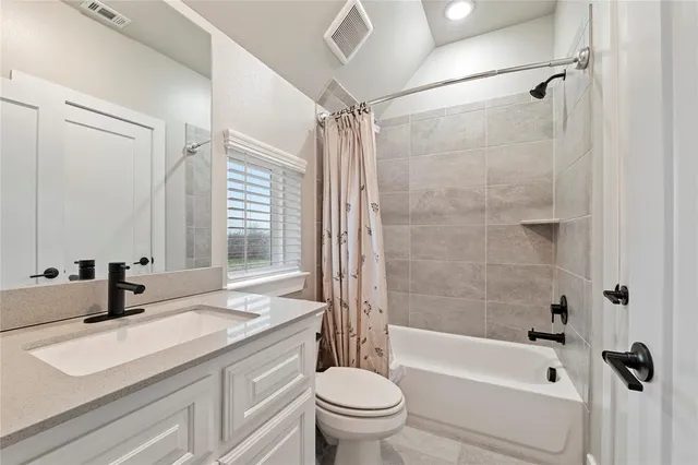 a bathroom with a sink a toilet and a bathtub