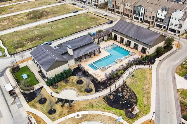 an aerial view of a house with swimming pool