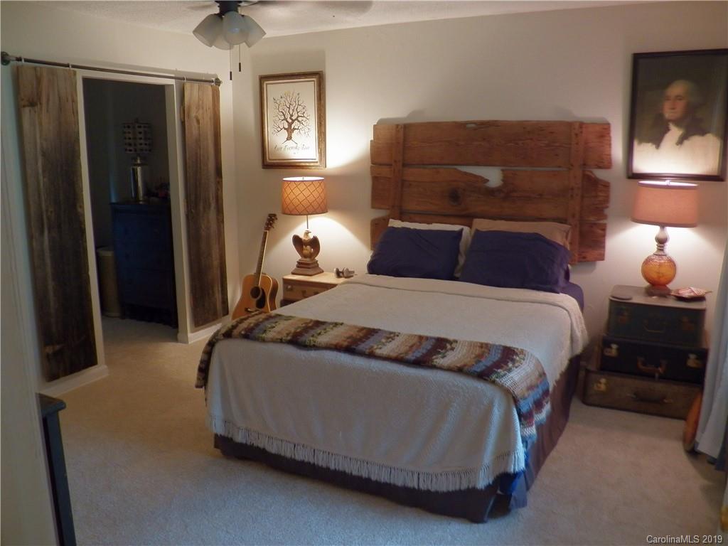 2545 Swanson Road Crouse, NC 28033 - Photo 12 of 14 a bedroom with a bed and lamp