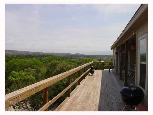 a view of balcony with furniture