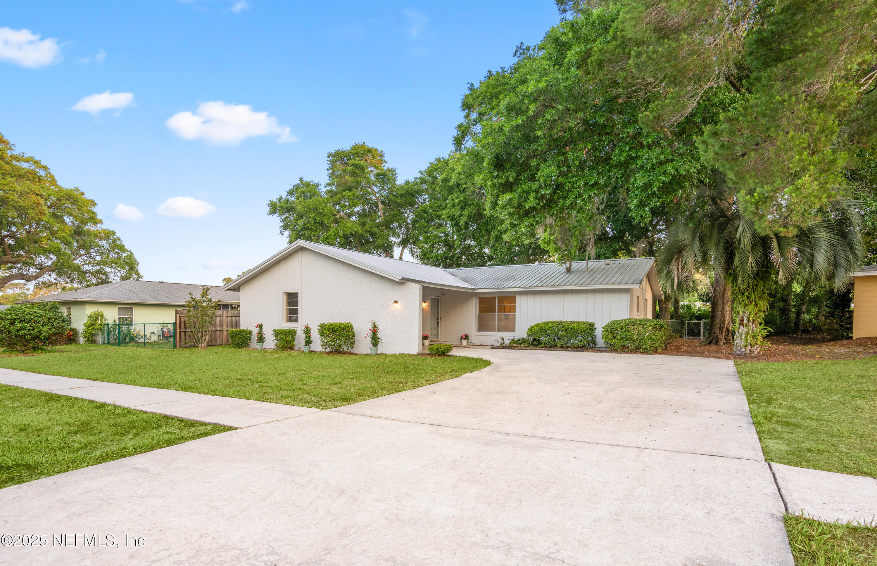 237 Marius Court St. Augustine, FL 32086 - Photo 1 of 45 a front view of a house with a yard and garage