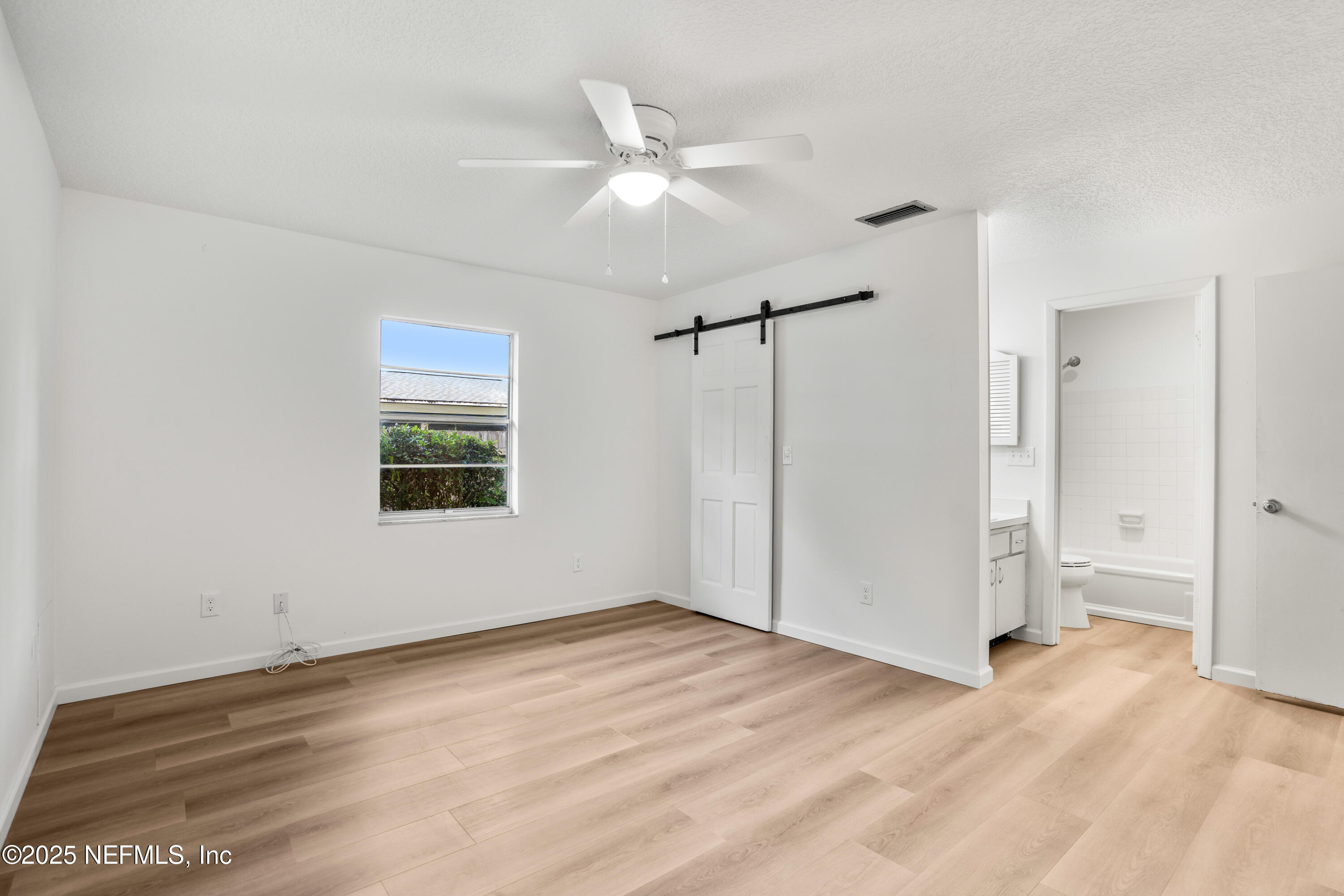 237 Marius Court St. Augustine, FL 32086 - Photo 12 of 45 a view of a room with wooden floor and white walls