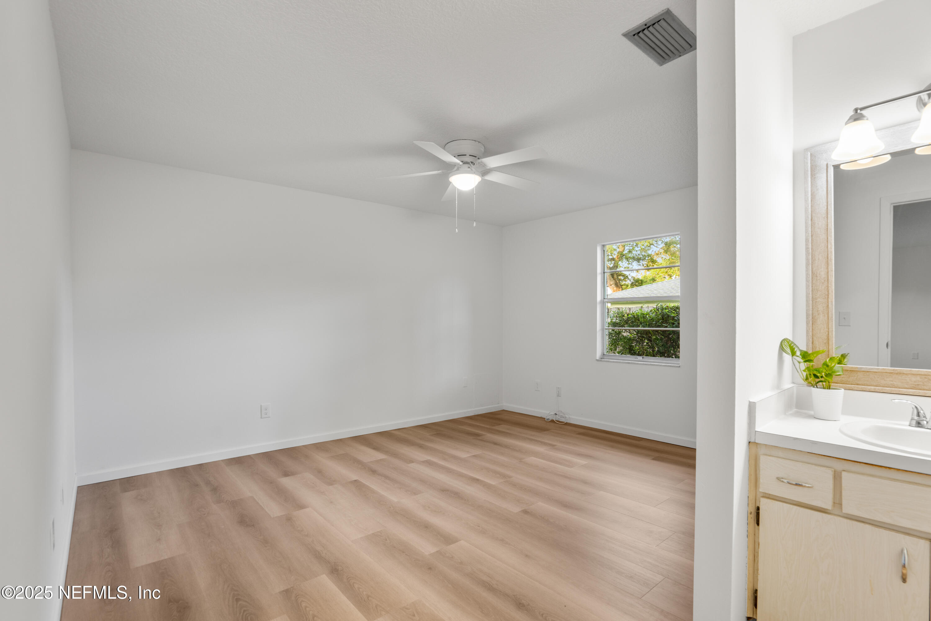 237 Marius Court St. Augustine, FL 32086 - Photo 14 of 45 an empty room with a window and a ceiling fan