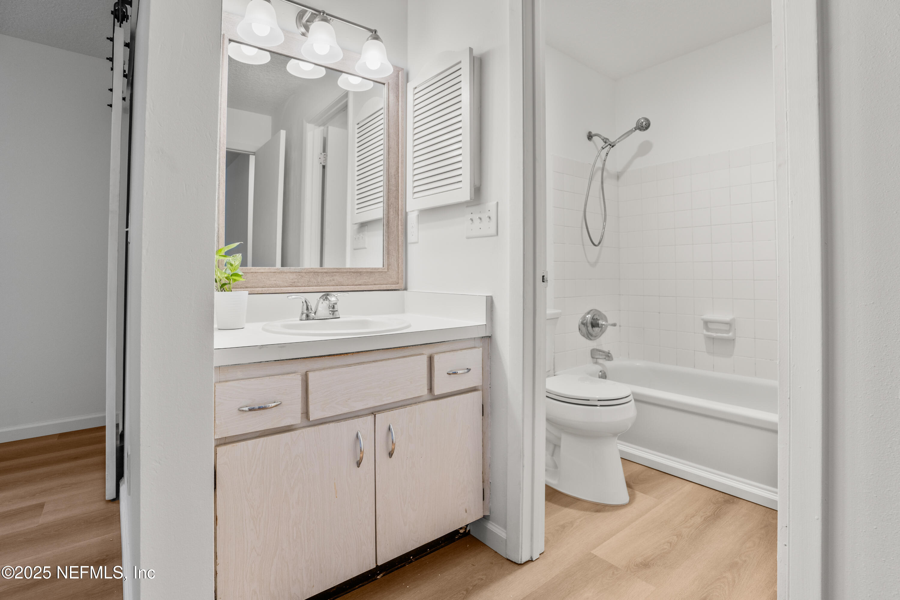 237 Marius Court St. Augustine, FL 32086 - Photo 15 of 45 a bathroom with a toilet a sink a mirror a bathtub and vanity