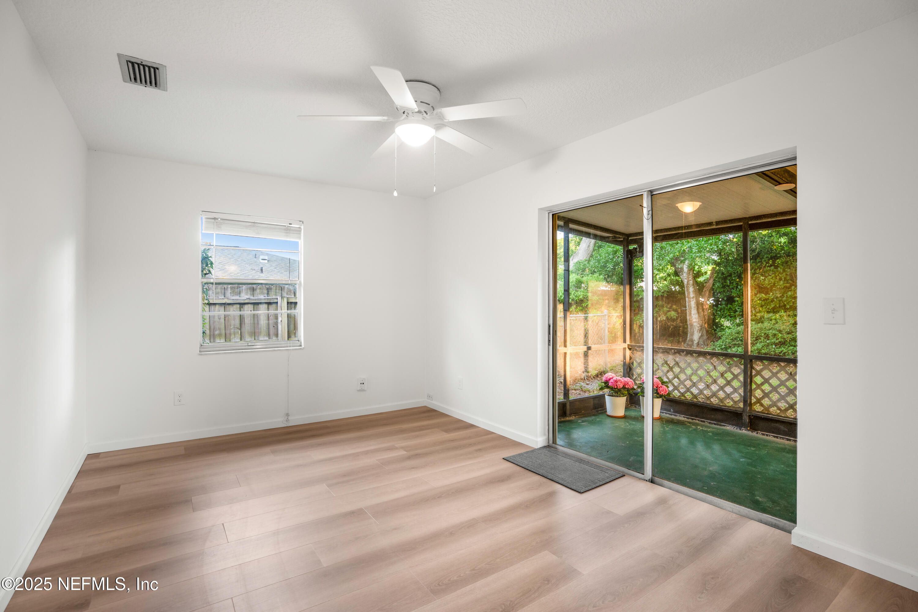 237 Marius Court St. Augustine, FL 32086 - Photo 20 of 45 a view of an empty room with glass door