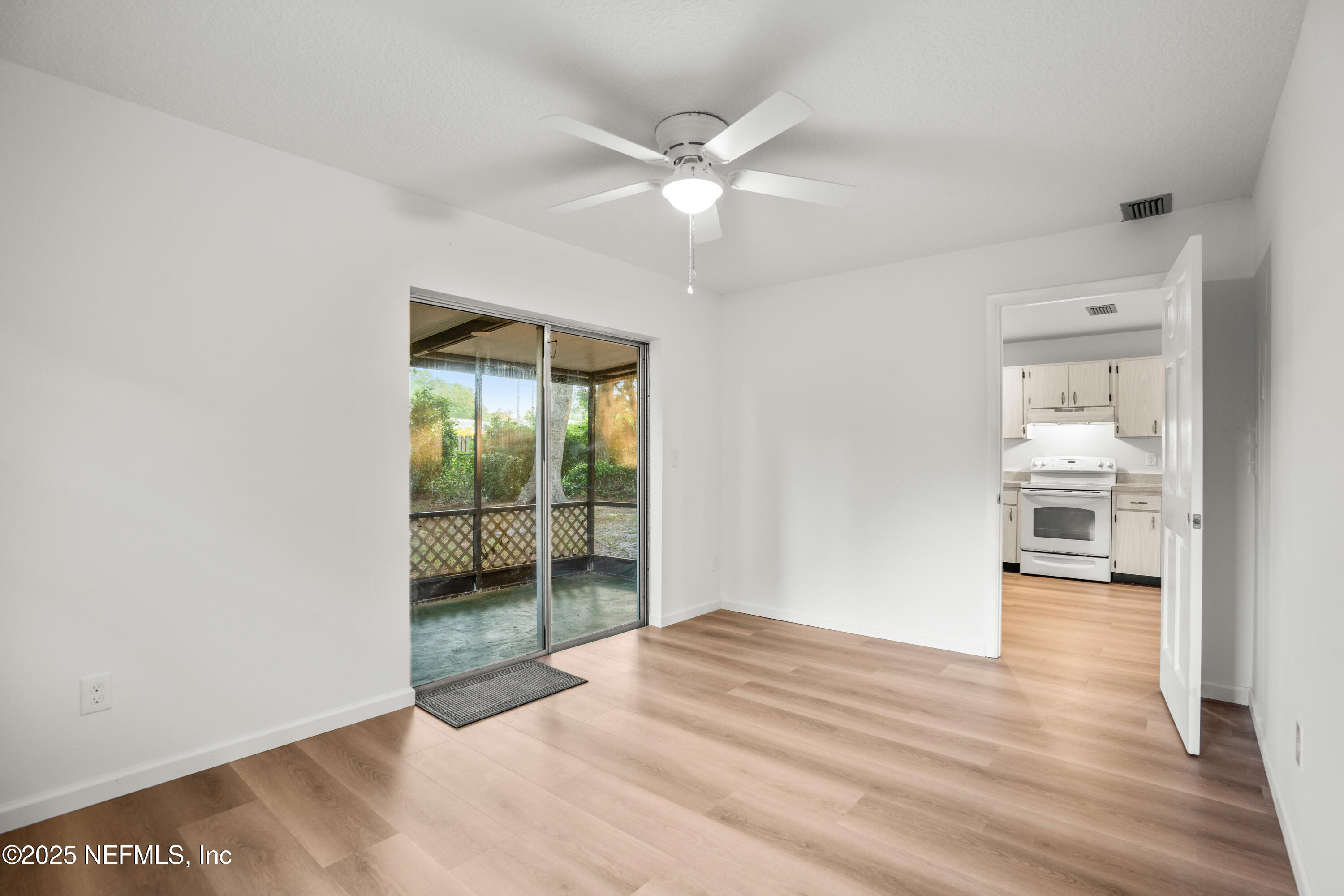 237 Marius Court St. Augustine, FL 32086 - Photo 21 of 45 wooden floor in an empty room with a window