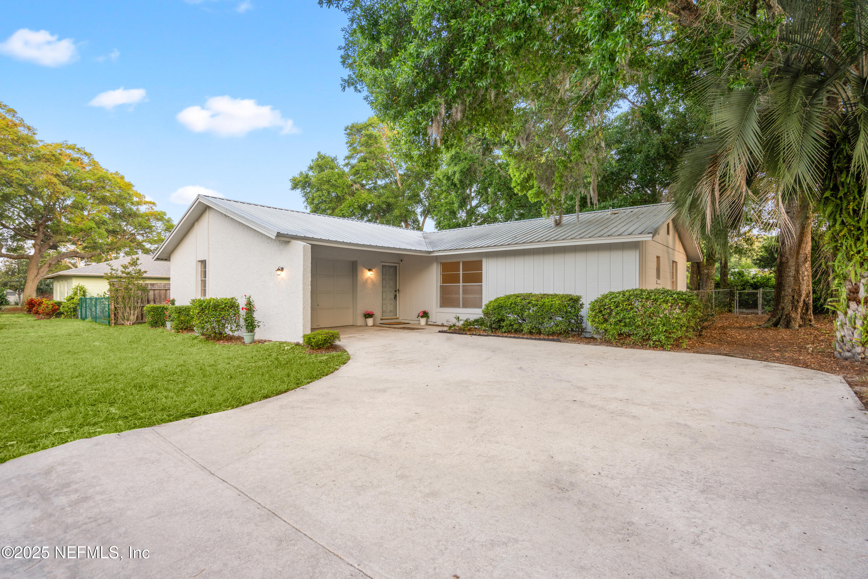237 Marius Court St. Augustine, FL 32086 - Photo 3 of 45 a view of a house with backyard and a garden
