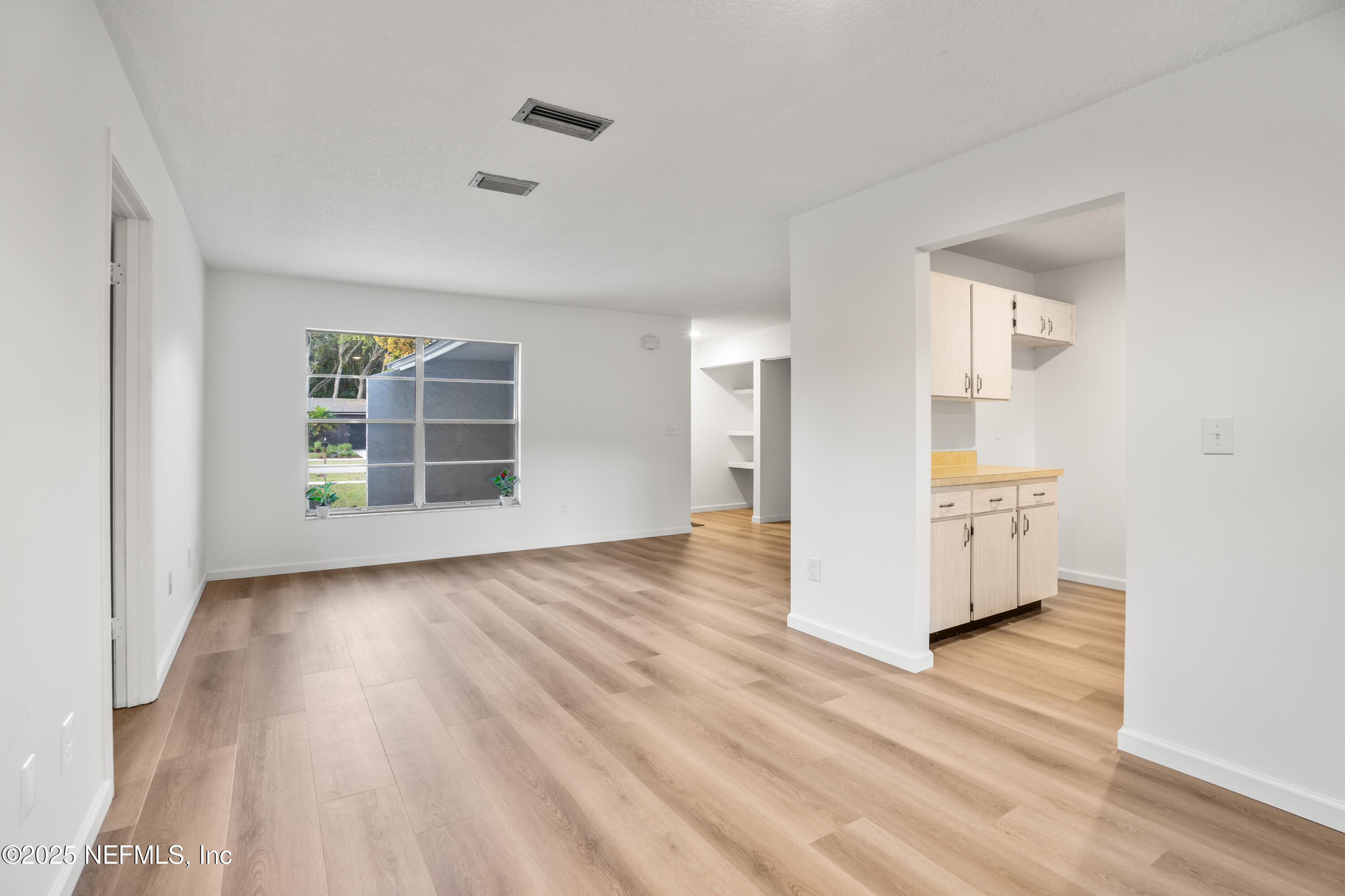 237 Marius Court St. Augustine, FL 32086 - Photo 6 of 45 wooden floor in an empty room with a window