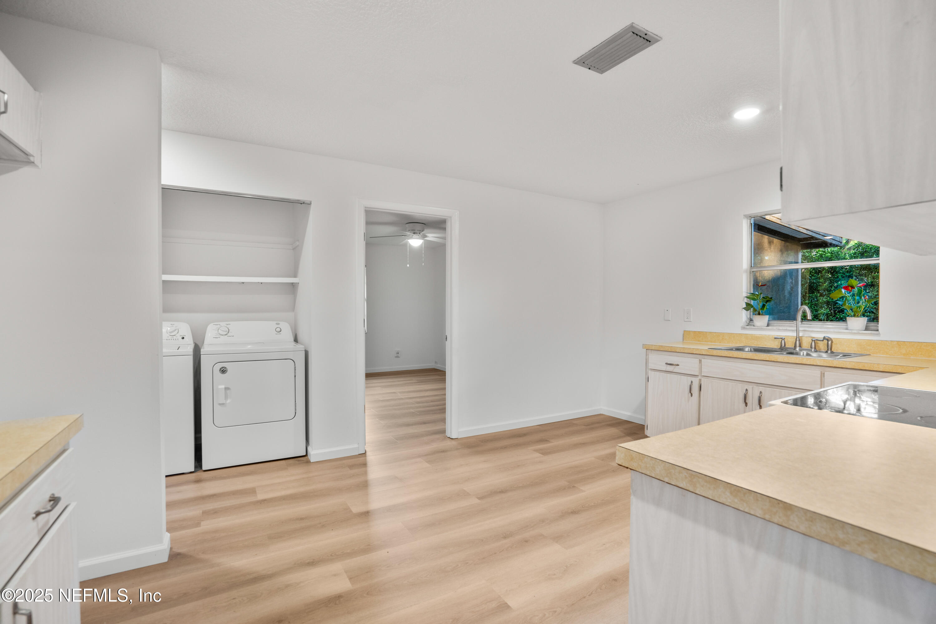 237 Marius Court St. Augustine, FL 32086 - Photo 8 of 45 a view of a kitchen with a sink cabinet and a window