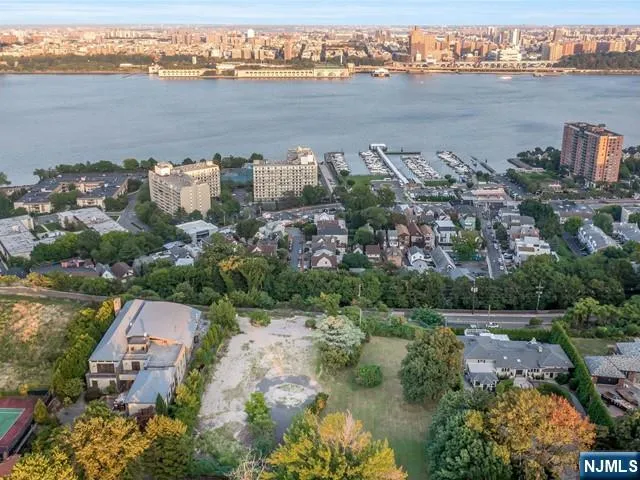 an aerial view of a city with a lake view
