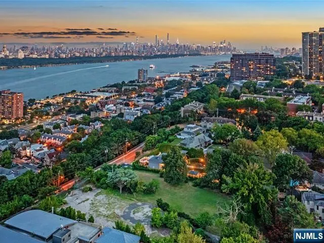 an aerial view of a city with lake view