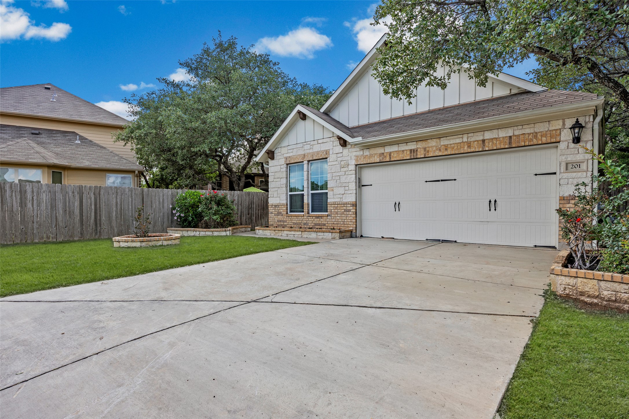 3451 Mayfield Ranch Boulevard, Unit 201 Round Rock, TX 78681 - Photo 28 of 29 a view of garage and yard