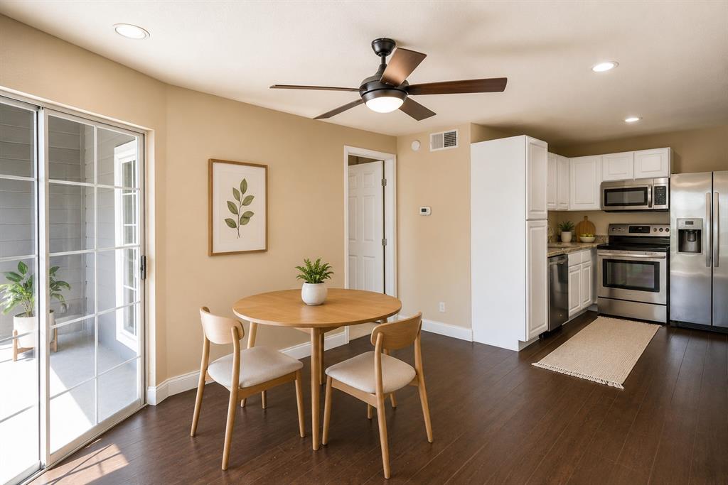 18333 Roehampton Drive, Unit 1036 Dallas, TX 75252 - Photo 2 of 12 Open-concept living area with dark wood-finish flooring, recessed lighting, and a modern ceiling fan