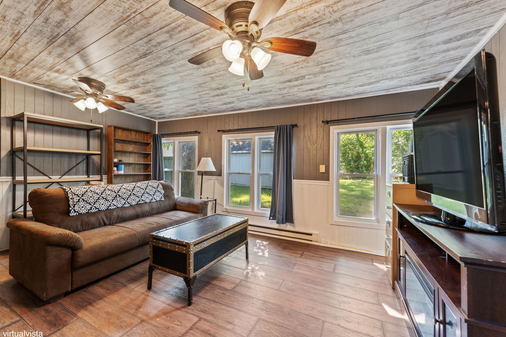 26177 West Lakeview Avenue Ingleside, IL 60041 - Photo 12 of 27 a living room with furniture and a flat screen tv