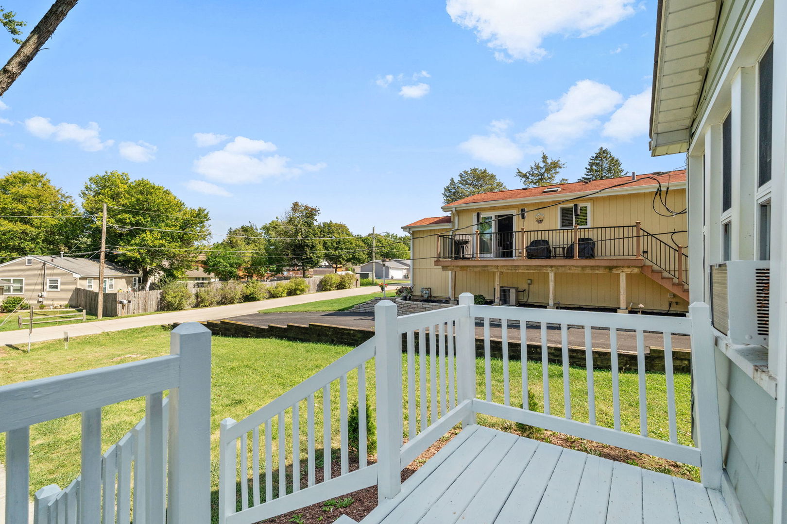 26177 West Lakeview Avenue Ingleside, IL 60041 - Photo 15 of 27 a view of a house with a wooden deck and furniture