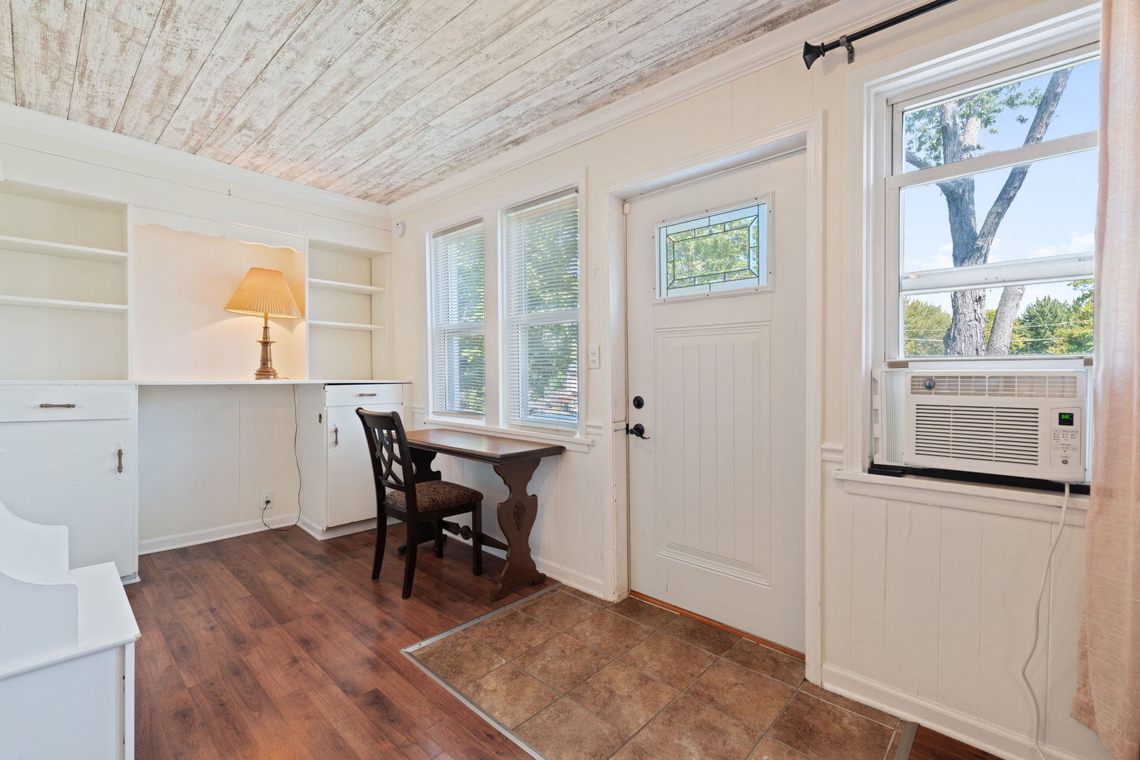 26177 West Lakeview Avenue Ingleside, IL 60041 - Photo 3 of 27 a workspace with wooden floor and a window