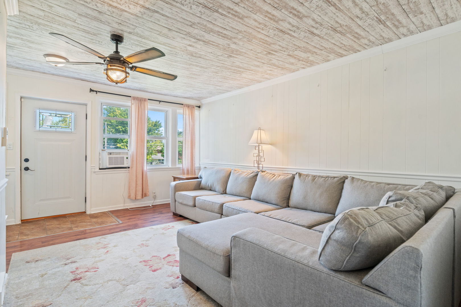 26177 West Lakeview Avenue Ingleside, IL 60041 - Photo 4 of 27 a living room with furniture a chandelier and a window
