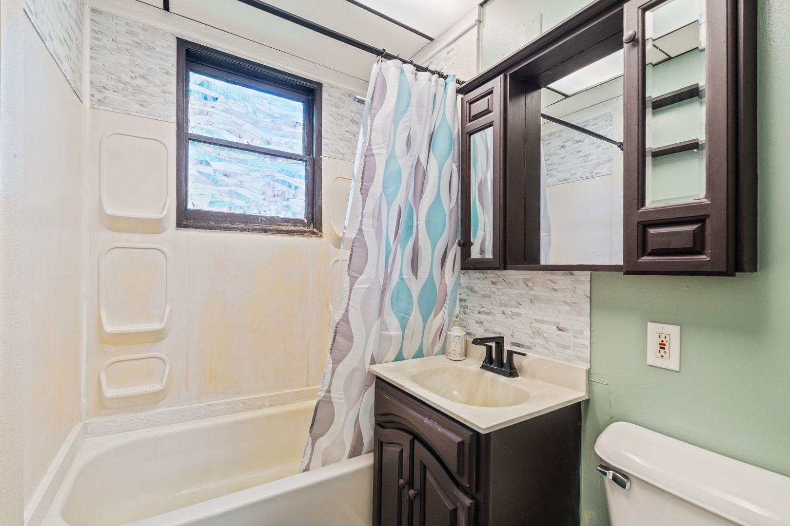 26177 West Lakeview Avenue Ingleside, IL 60041 - Photo 6 of 27 a bathroom with a sink a toilet and a bathtub