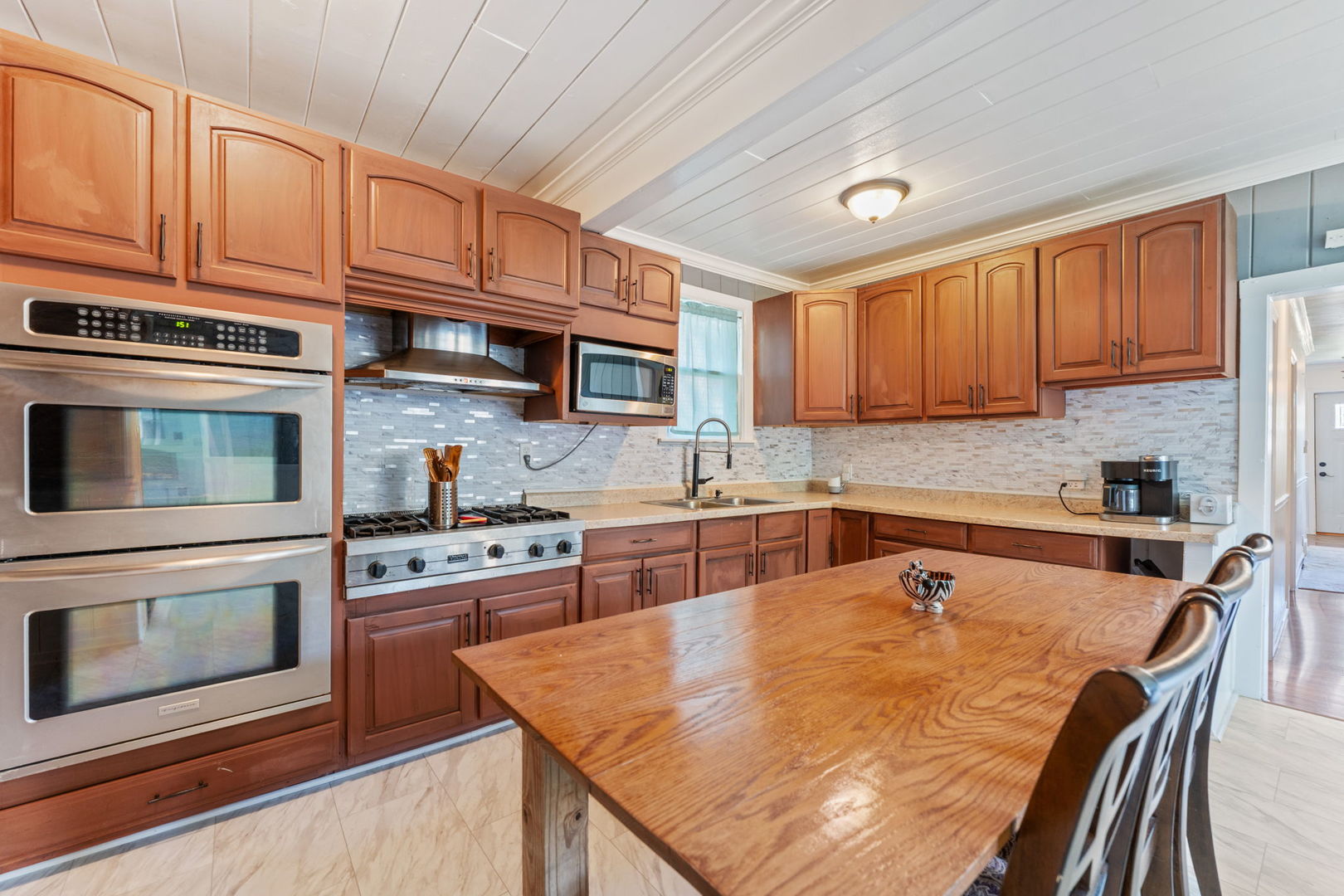 26177 West Lakeview Avenue Ingleside, IL 60041 - Photo 8 of 27 a kitchen with stainless steel appliances granite countertop a stove sink microwave and cabinets