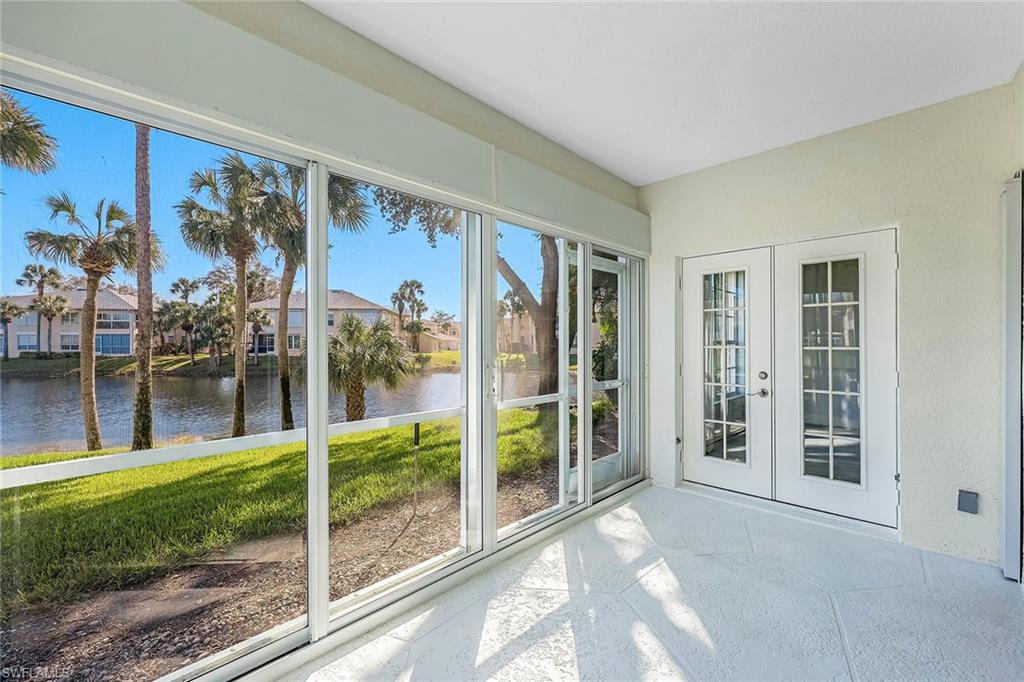 654 Wiggins Lake Drive, Unit 101 Naples, FL 34110 - Photo 16 of 50 a view of a house with a porch