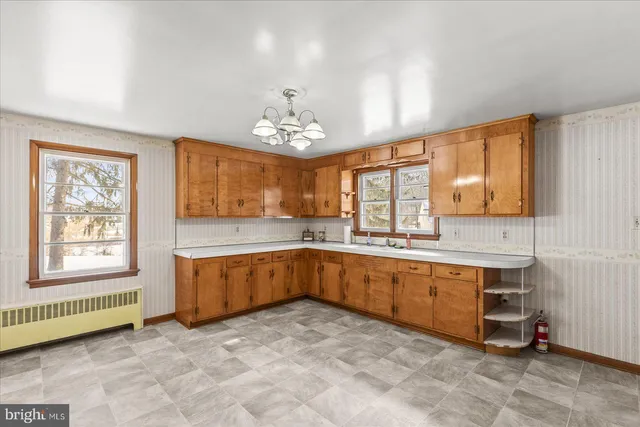 a large bathroom with a large tub and sink