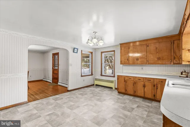 a view of a kitchen with granite countertop cabinets and window