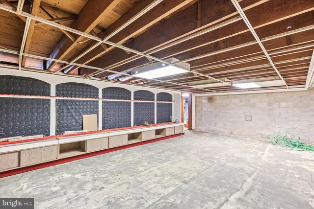 a view of an empty room with windows