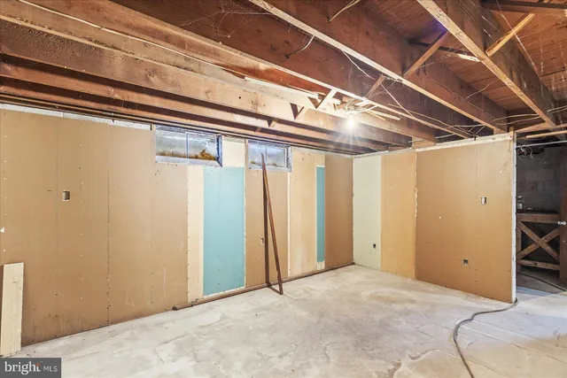 a view of a room with wooden walls