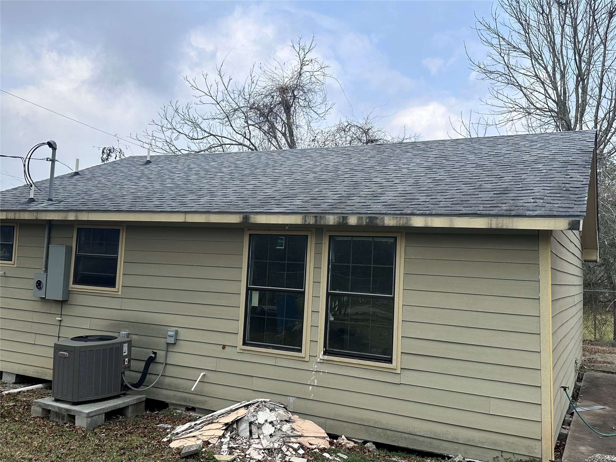 800 Mayo Street Baytown, TX 77520 - Photo 2 of 8 a view of a stone house with large windows